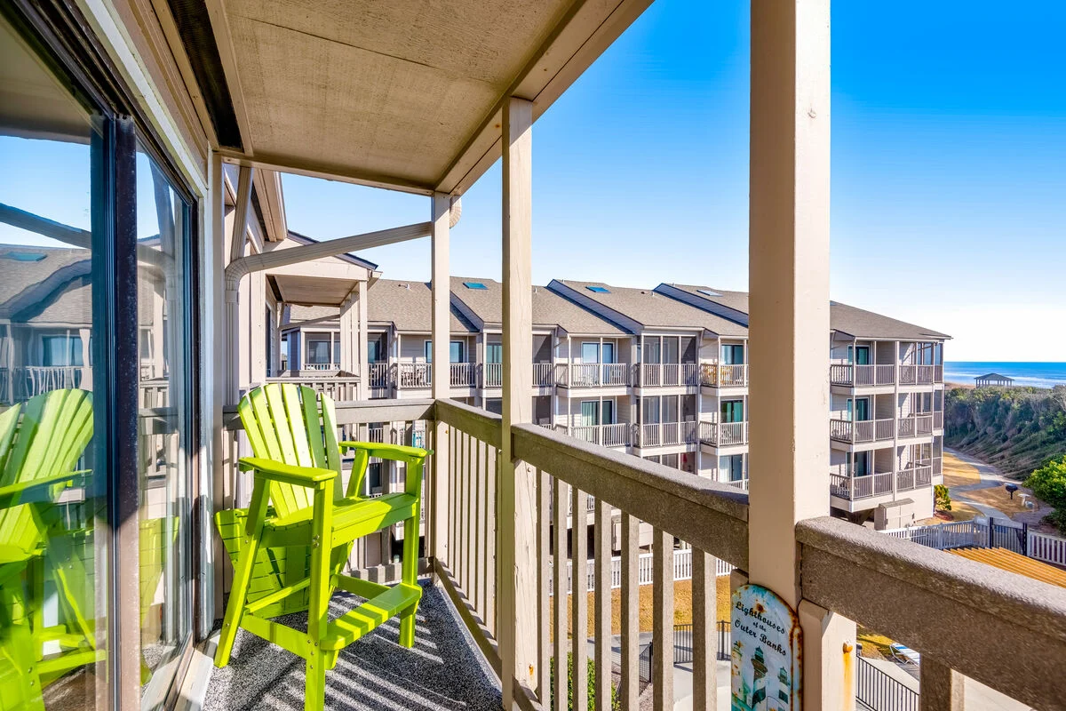 Adirondack chair on the balcony at Island Beach & Racquet Club B302