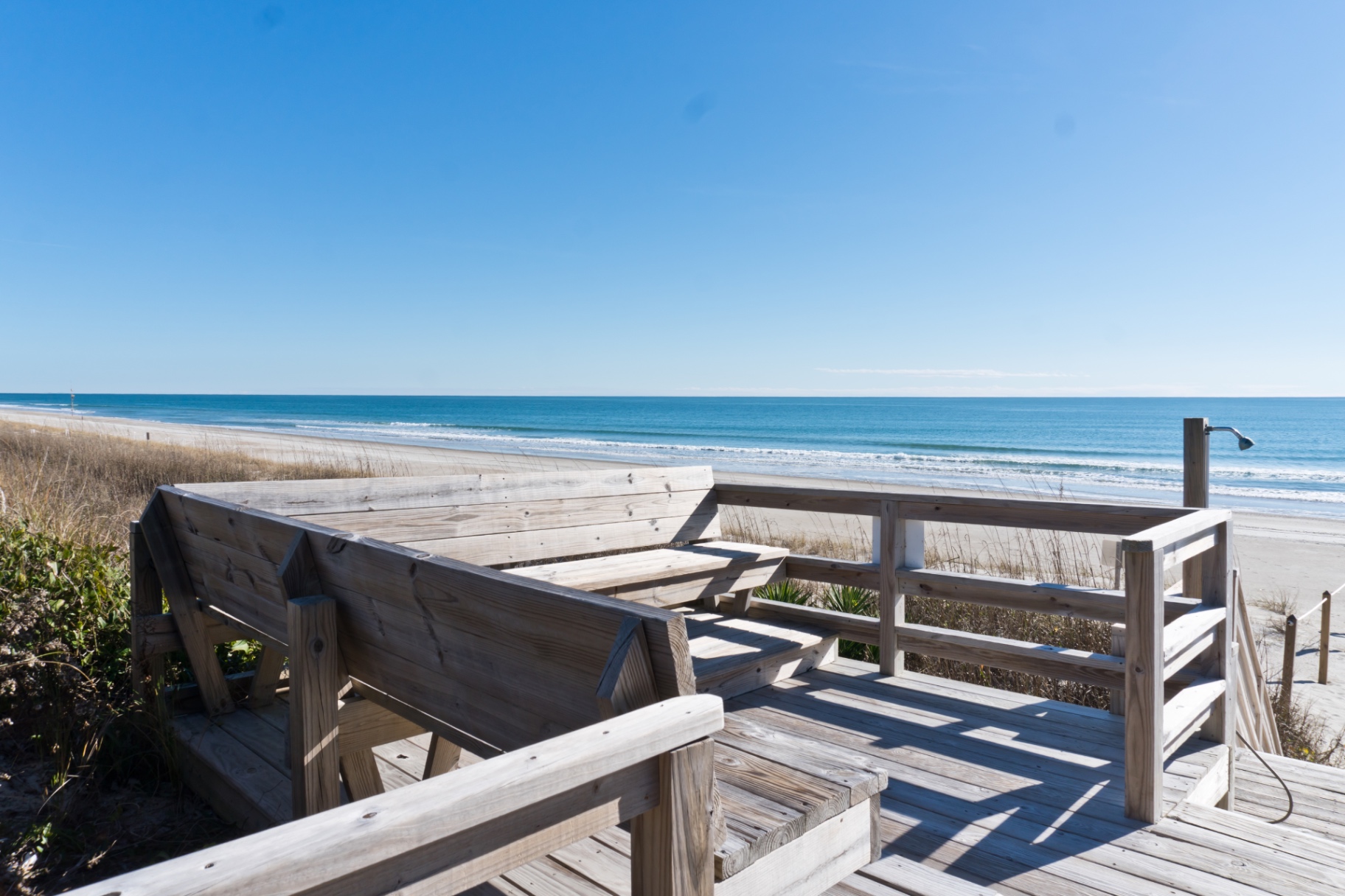 Oceanfront deck with built-in benches at Coral Shores 12